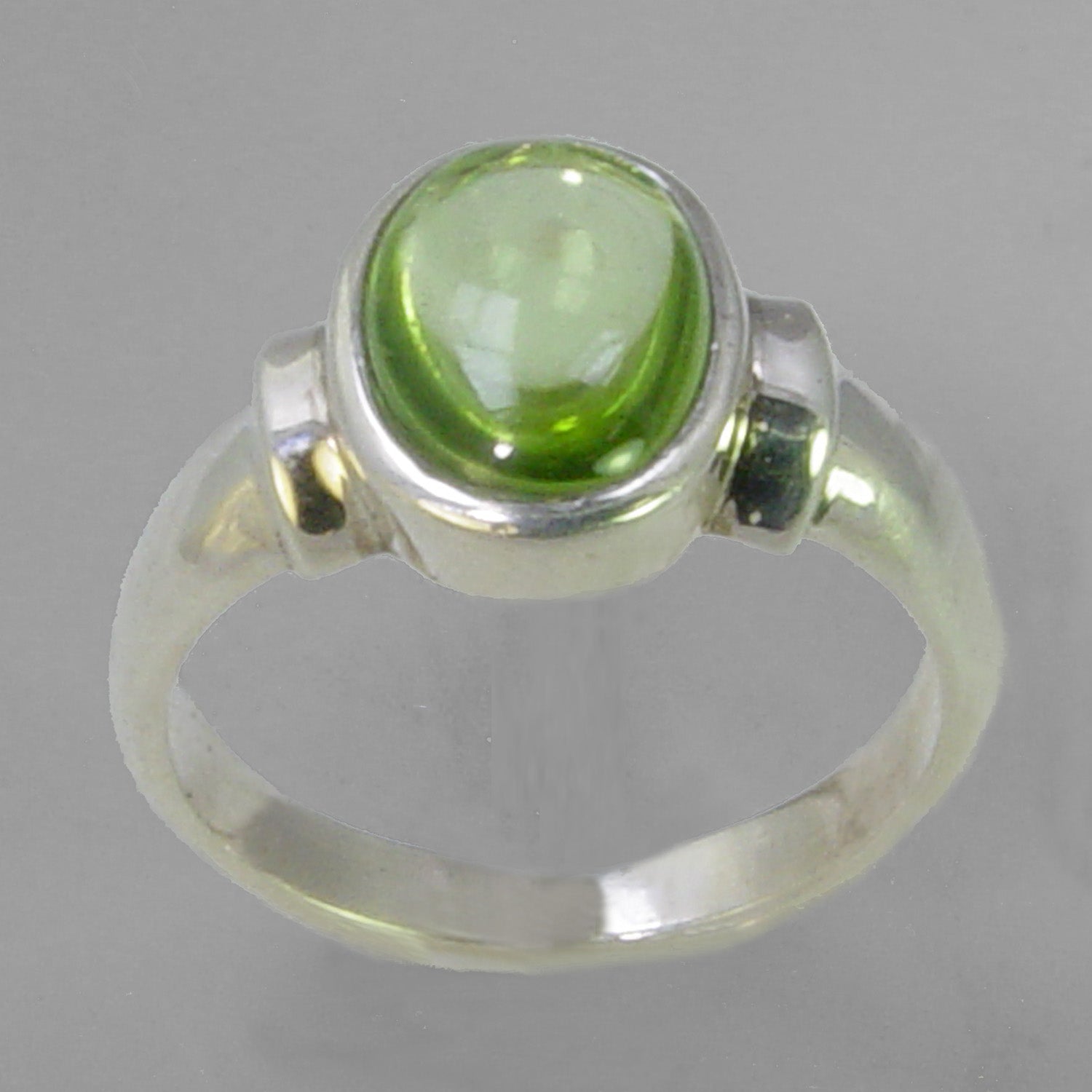 Peridot 4.1 ct Oval Cab Bezel Set Sterling Silver Ring, Size 8.25