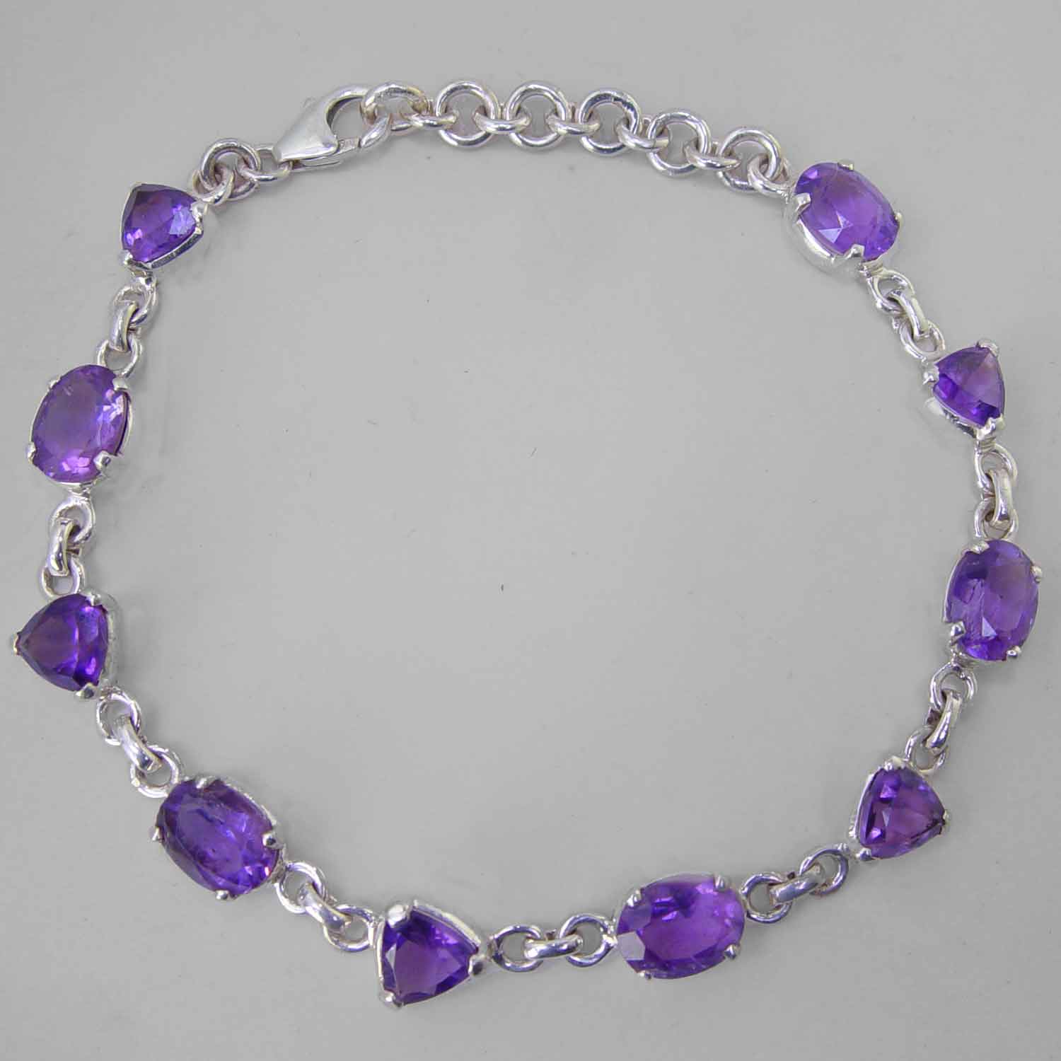 Amethyst Faceted Trillion Cut and Oval Sterling Silver Link Bracelet - 3 CTW