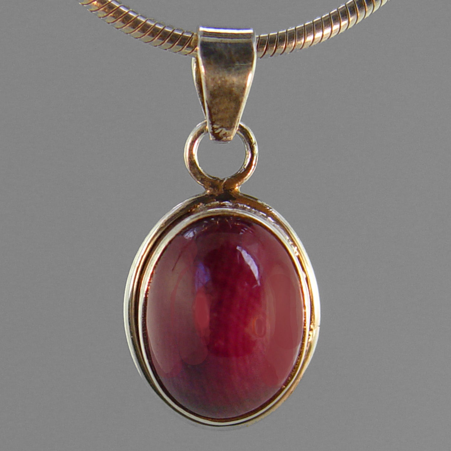 Ruby 10 ct Oval in Sterling Silver Pendant - Northern Lights