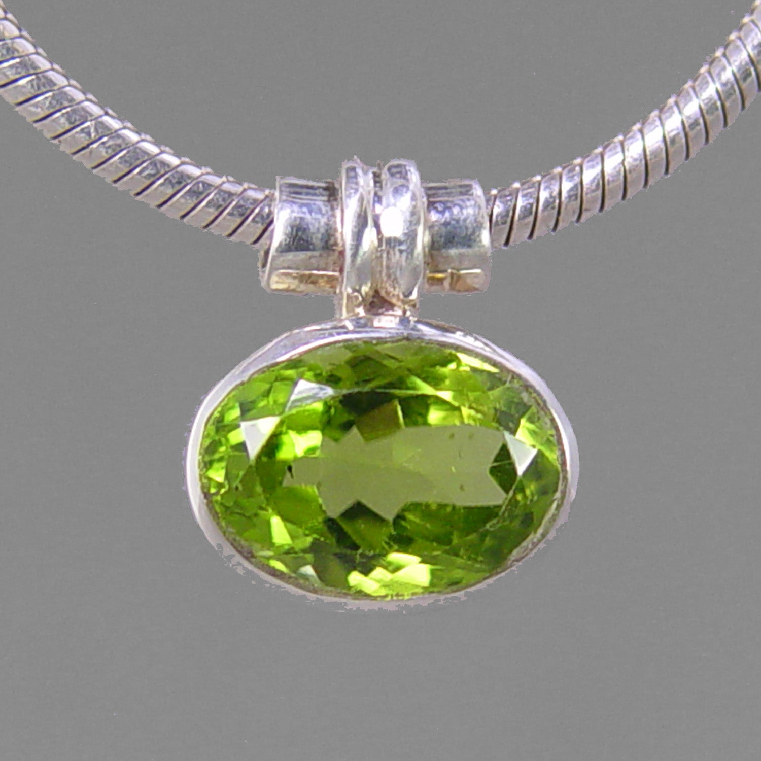 Peridot 3.5 ct Faceted Oval Bezel Set Sterling Silver Pendant