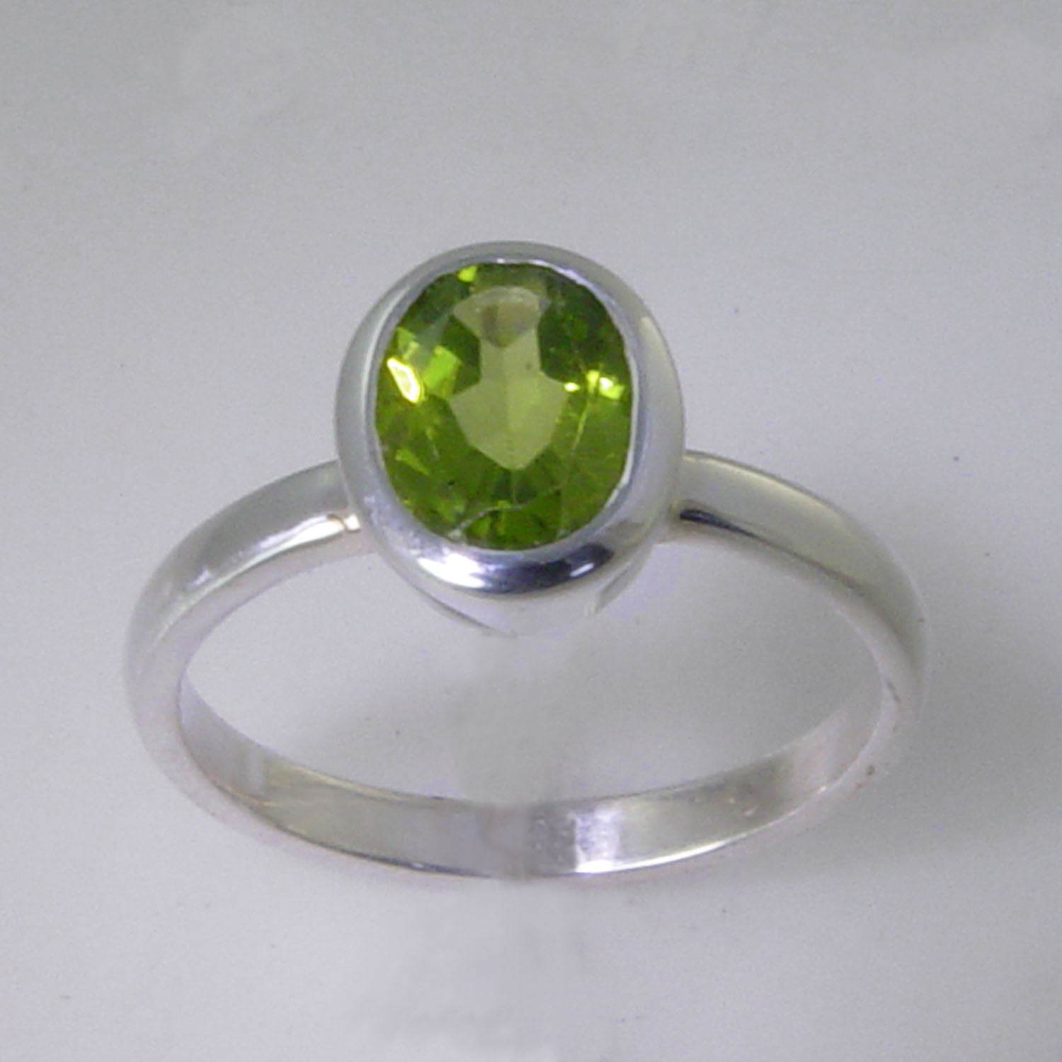 Peridot 2.5 ct Oval Bezel Set Sterling Silver Ring, Size 7.5