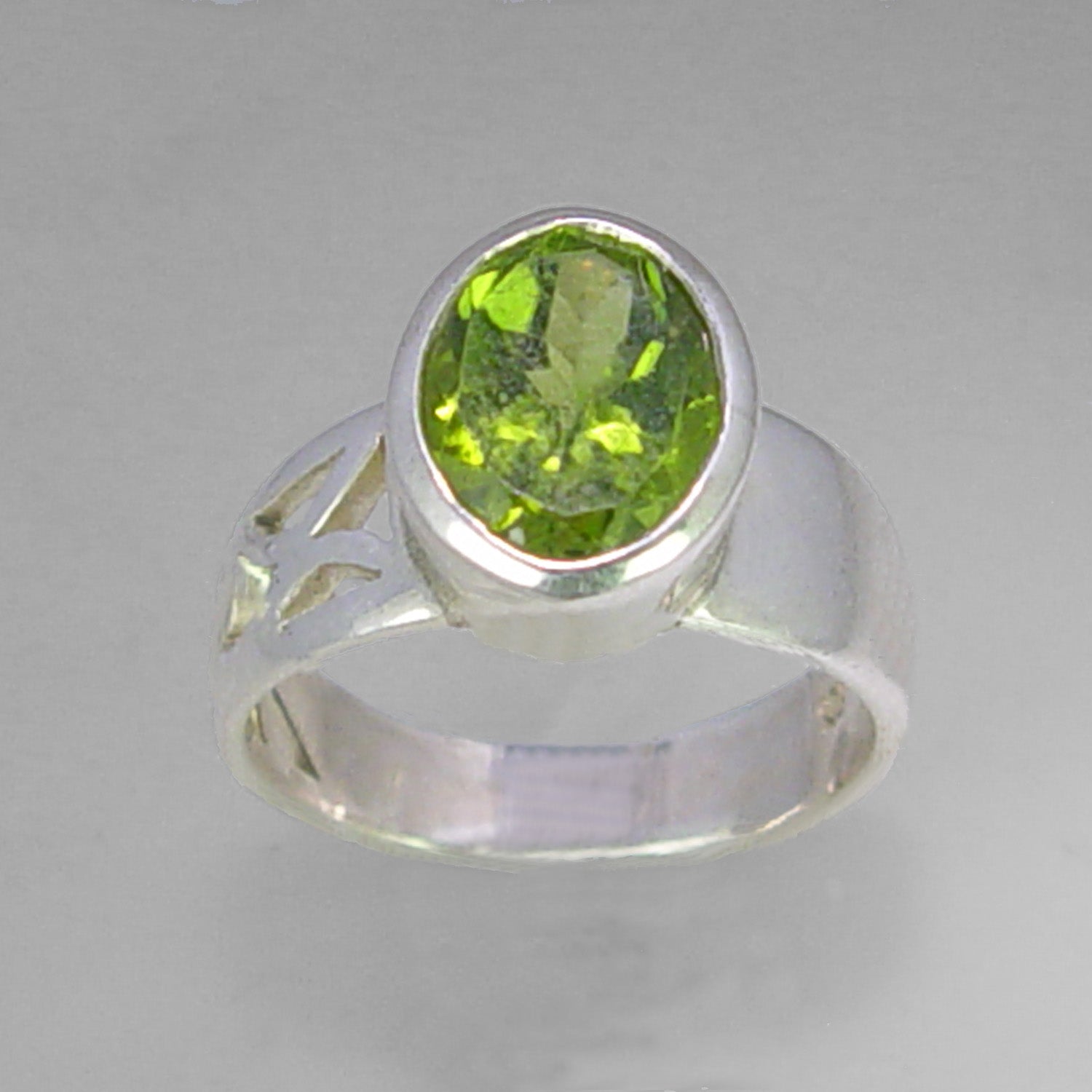 Peridot 4.5 ct Oval Fancy Bezel Set Sterling Silver Ring, Size 8