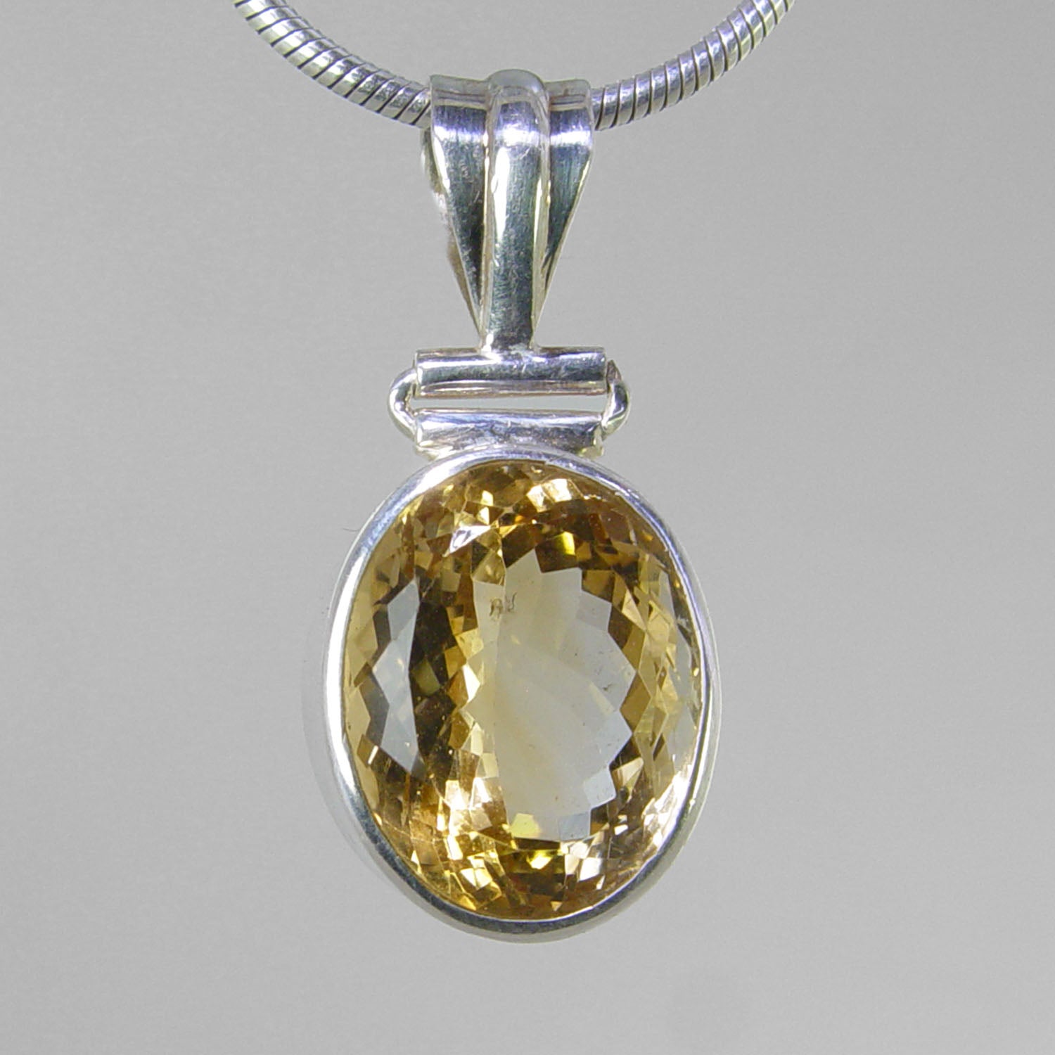 Citrine 12 ct Faceted Oval Bezel Set Sterling Silver Pendant