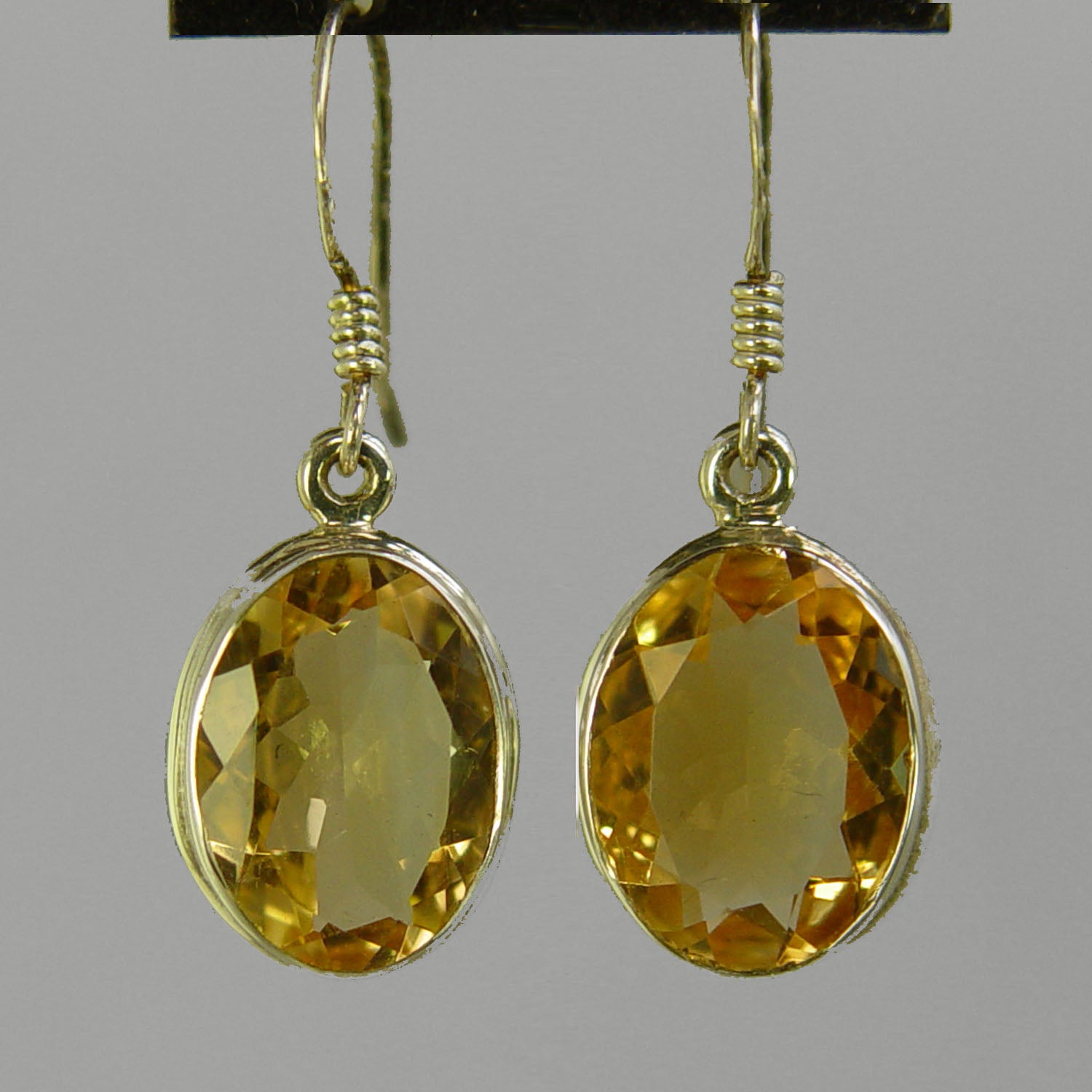 Citrine 12 ctw Faceted Oval Bezel Set Earrings