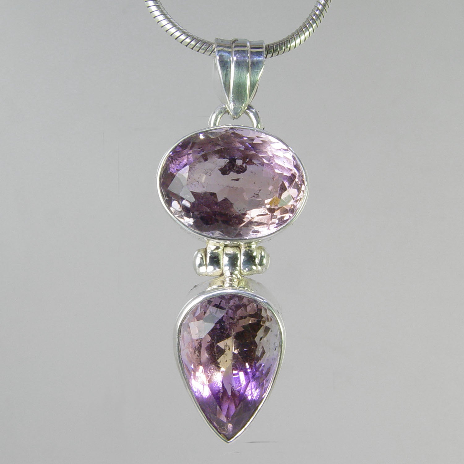 Amethyst 19 tcw Faceted Oval and Pear Shapes Bezel Set Sterling Silver Pendant