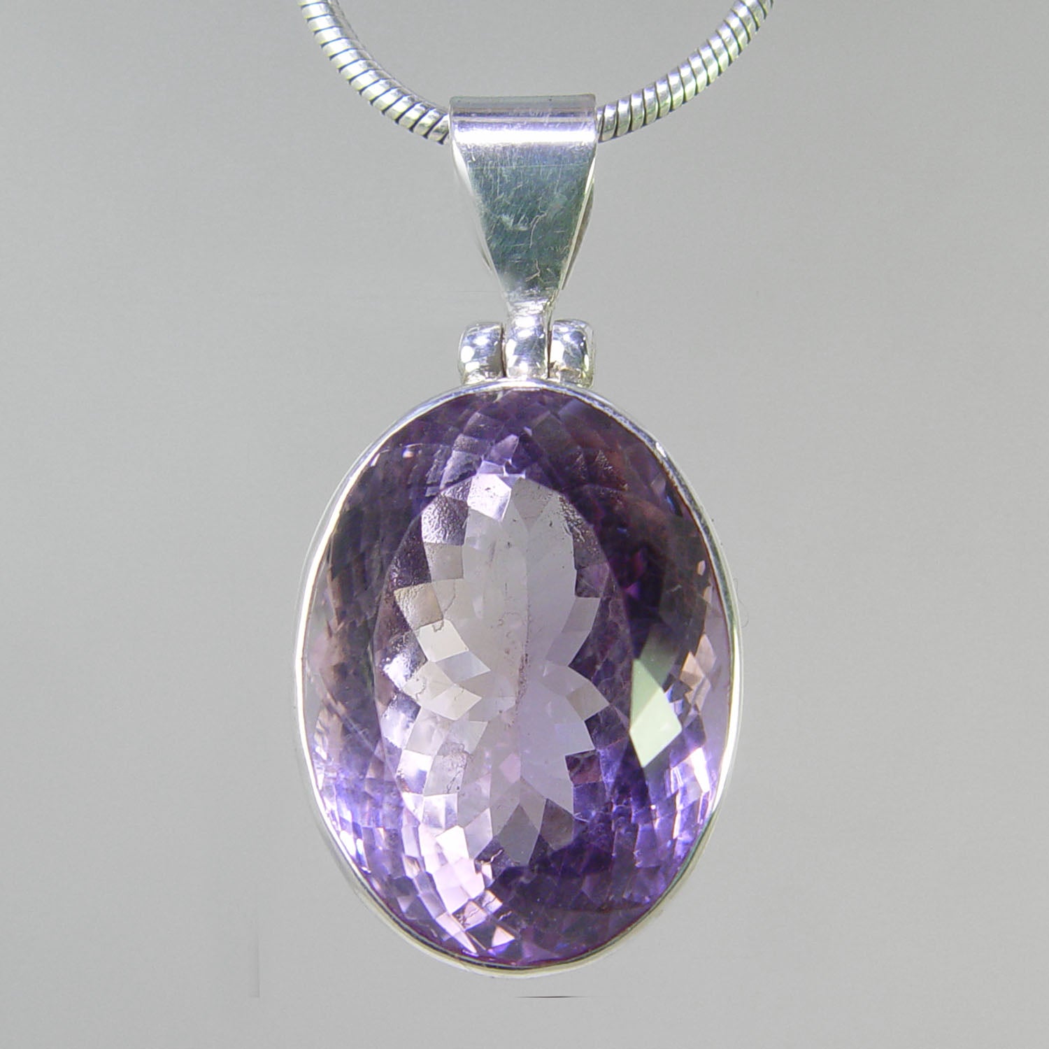 Amethyst 28 ct Faceted Oval Bezel Set Sterling Silver Pendant