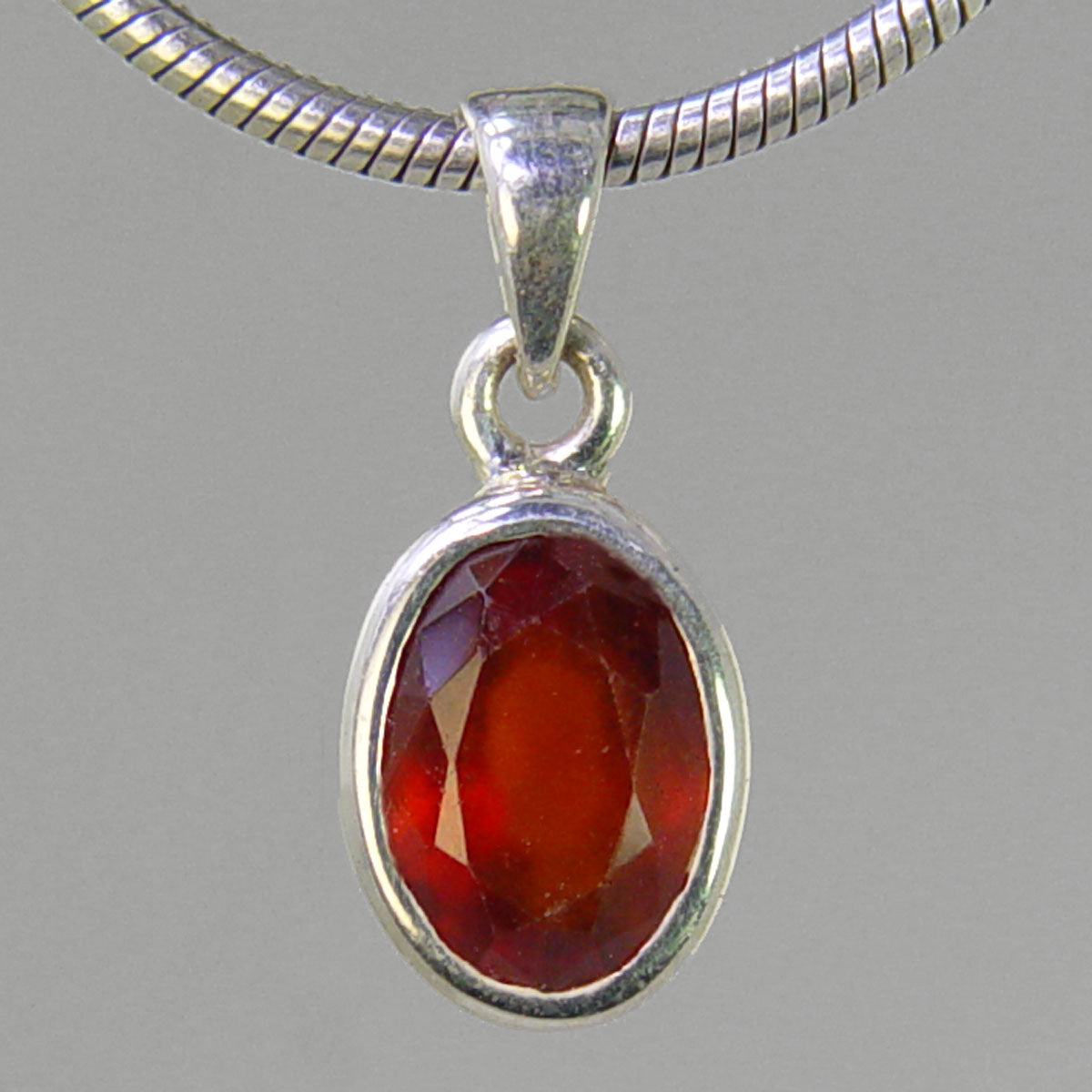 Hessonite Garnet ct Faceted Oval Bezel Set Sterling Silver